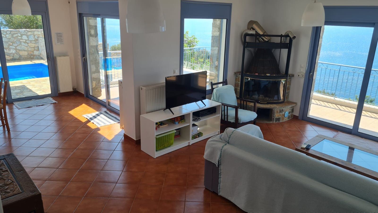 Living room with fireplace and sea view