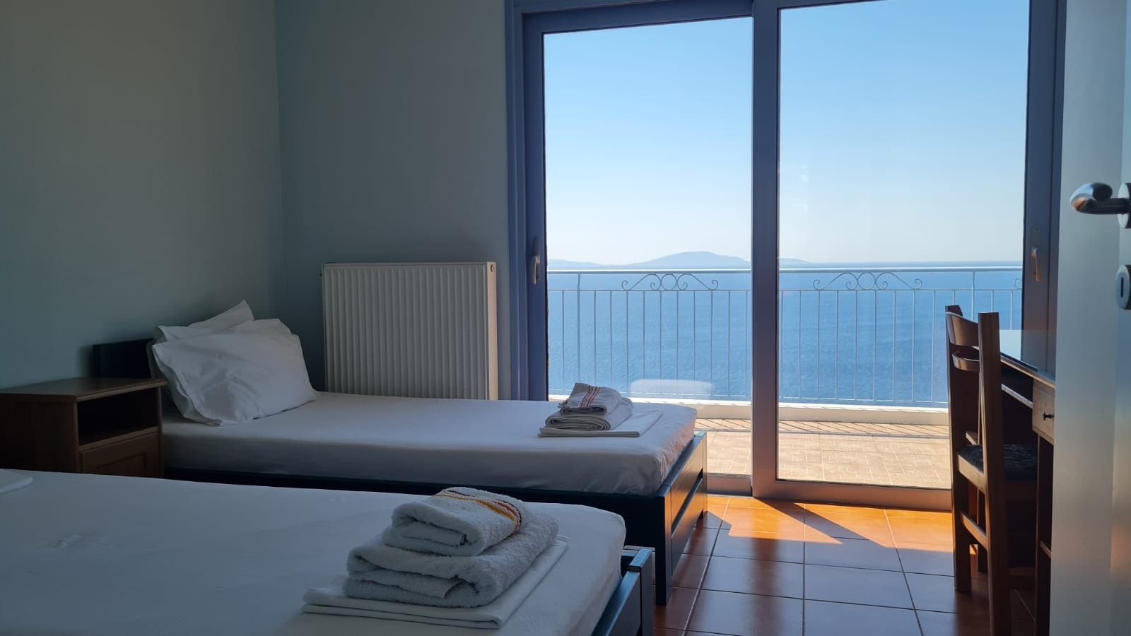 Twin bedroom with balcony and sea view
