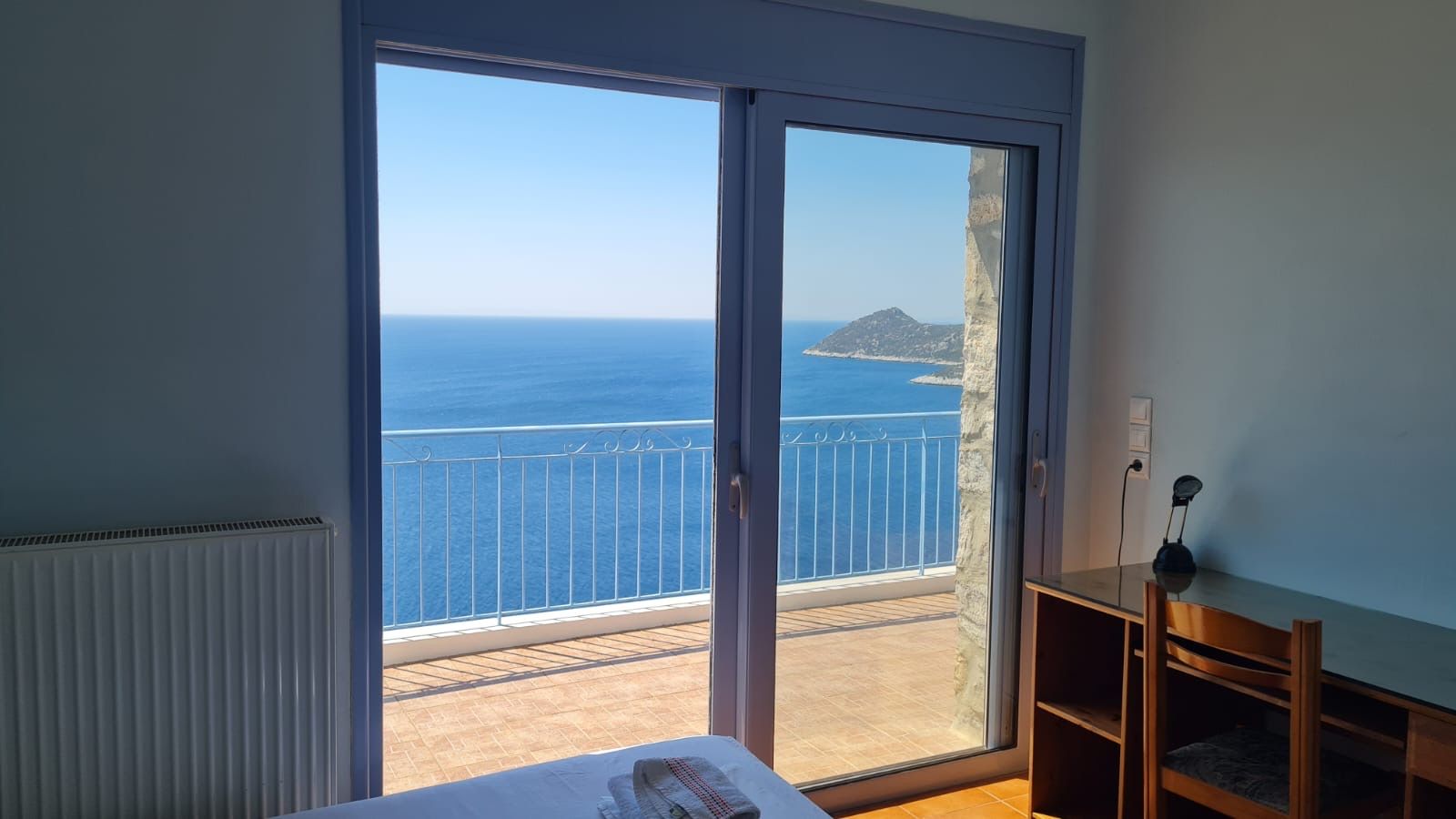 Bedroom opening onto the sea-facing balcony