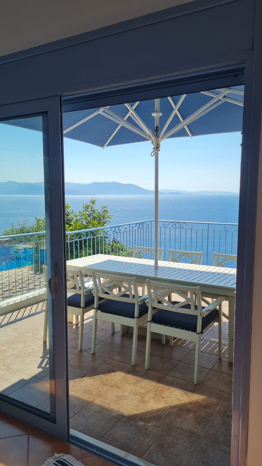 Outdoor dining table under the umbrella